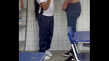 Hot young girl in uniform giving a great time in the classroom to her well-endowed friend, moaning and coming.