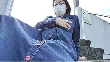 A married woman masturbating outdoors, trying not to get caught.