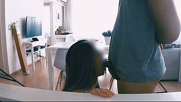 She gets a blowjob in the kitchen.