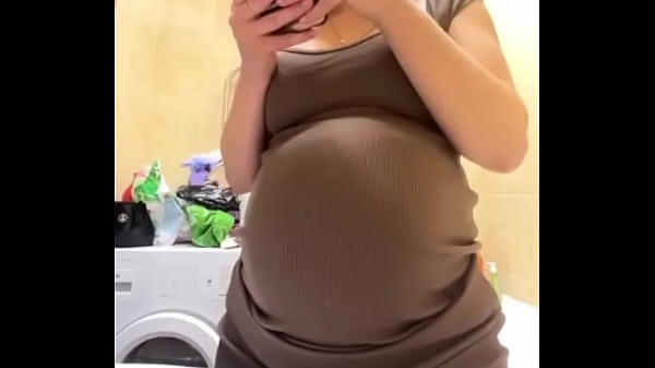 Pregnant stepmom shows milky tits in the bathroom
