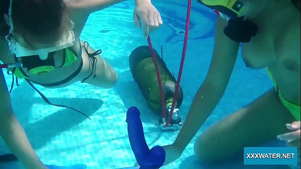 Two hot lesbians playing with dildos in the pool