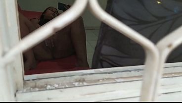 Horny neighbor caught through the window. She secretly spied on my neighbor while she masturbates, she has a beautiful pussy and it looks very wet, she sees that she is very slutty and wants big cocks. In the end he spoke to him