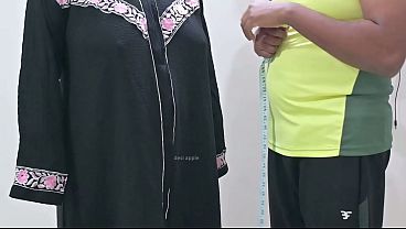 Indian tailor having fun with hijab lady