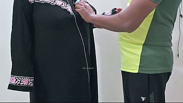 Indian tailor having fun with hijab lady
