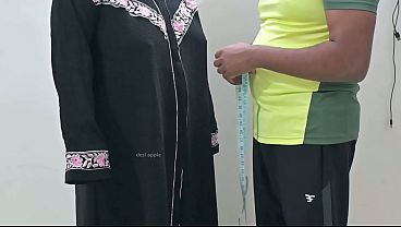 Indian tailor having fun with hijab lady