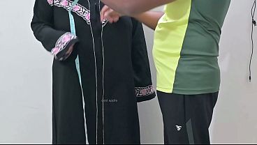 Indian tailor having fun with hijab lady
