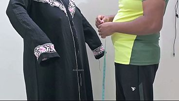 Indian tailor having fun with hijab lady