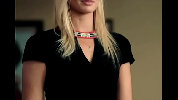 Margot Robbie straightens the dress