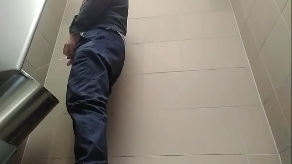 Download Video - Young guy peeing with his uncut cock in a highway toilet