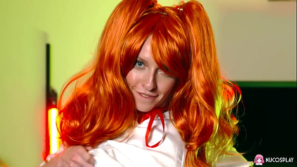 Horny redhead Stella Bliss plays passionately with a dildo on the couch.
