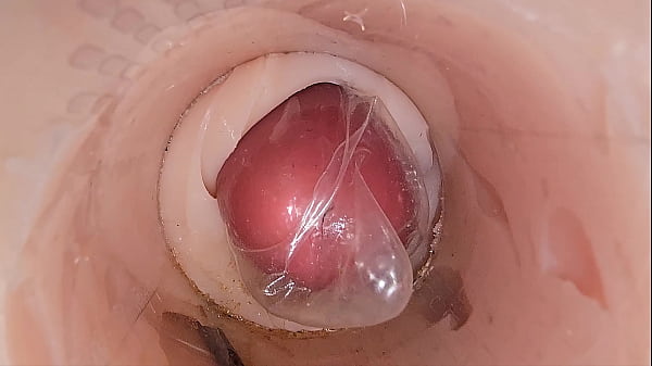 thumb the camera in the deep pussy records a huge ejaculation of sperm into the condom