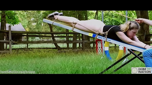 Download Video - Cum-covered 19 year-old teen bondage slave&comma; PAWG Lexi Grey&comma; crawls to the seesaw for a hard caning on her big ass