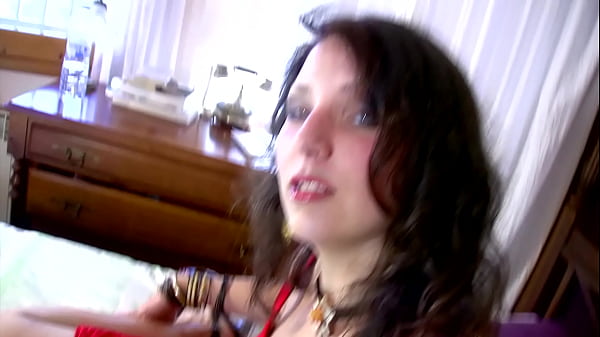 Her big tits stick out of her open shirt and her feet and legs are covered in white stockings