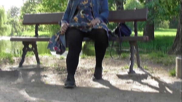 Hairy mature in transparent dress flashing in the park