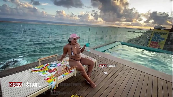 Dancing in a micro bikini in the hotel pool