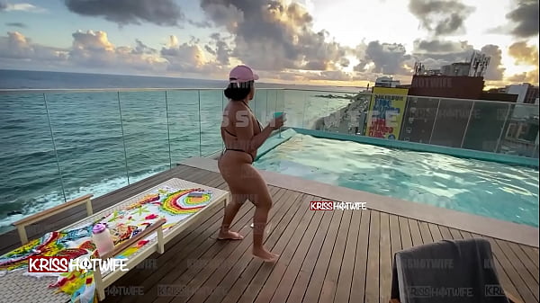 Dancing in a micro bikini in the hotel pool