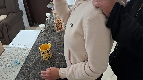 A stepdaughter is surprised while having breakfast.