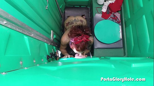 Porta Gloryhole Mature Redhead slurping cocks