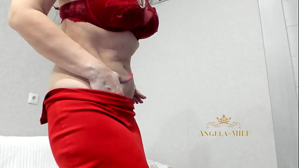 The most beautiful MILF on the planet flirts with her fans while sexy removing her red lingerie / Angela-MILF
