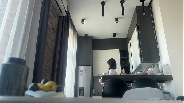 Sexy fit brunette does housework without panties.
