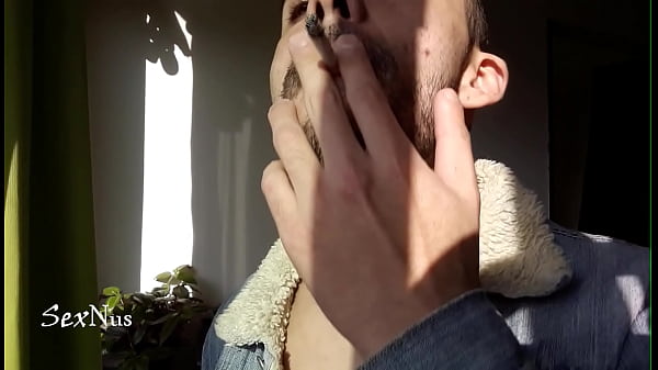 Erotically smoking at the window