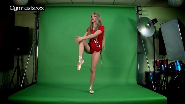 Red Dressed Gymnast Doing Spreads