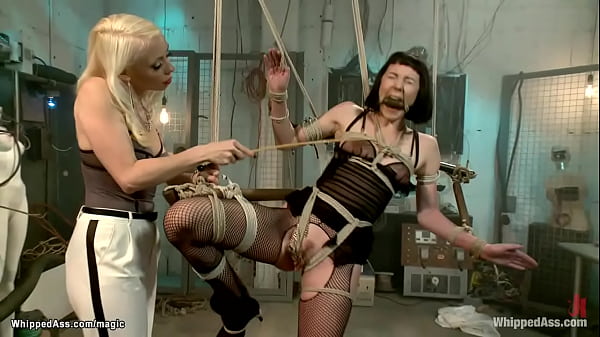 Lesbian bound to wooden sticks whipped