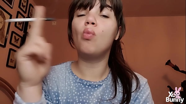 Big lips covered in lipgloss smoking with close up of the lips