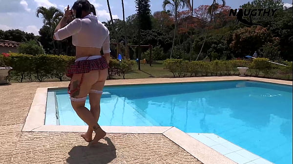 Hot girl enjoys masturbating by the pool