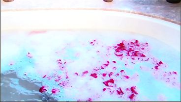 Longe haired brunette shaves, washes and diddles herself in sudsy tub