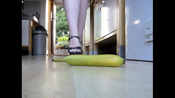 Banana crush whilst dressed in latex dress & high heels